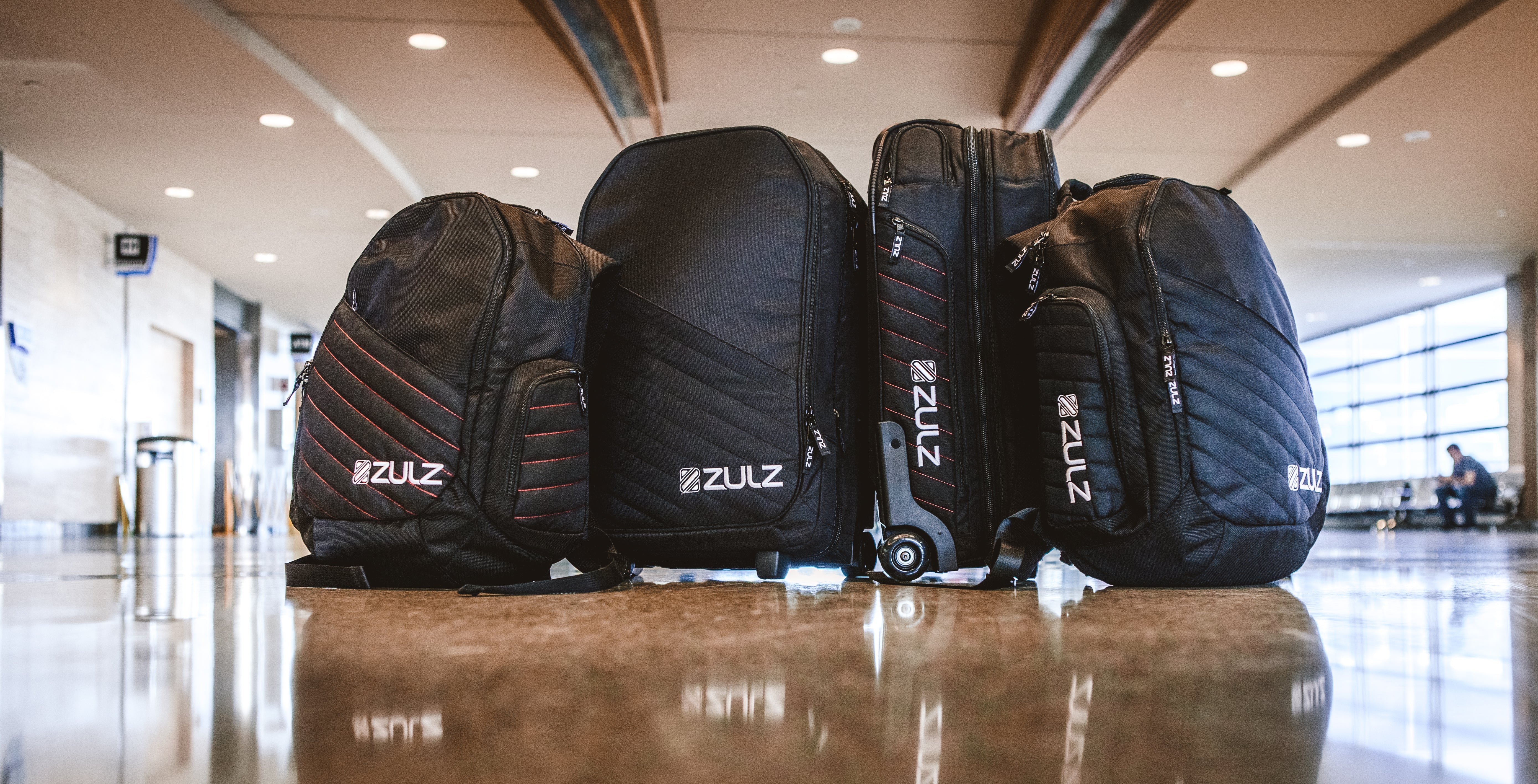 A collection of travel inspired luggage including backpacks, carry-ons and check size bags