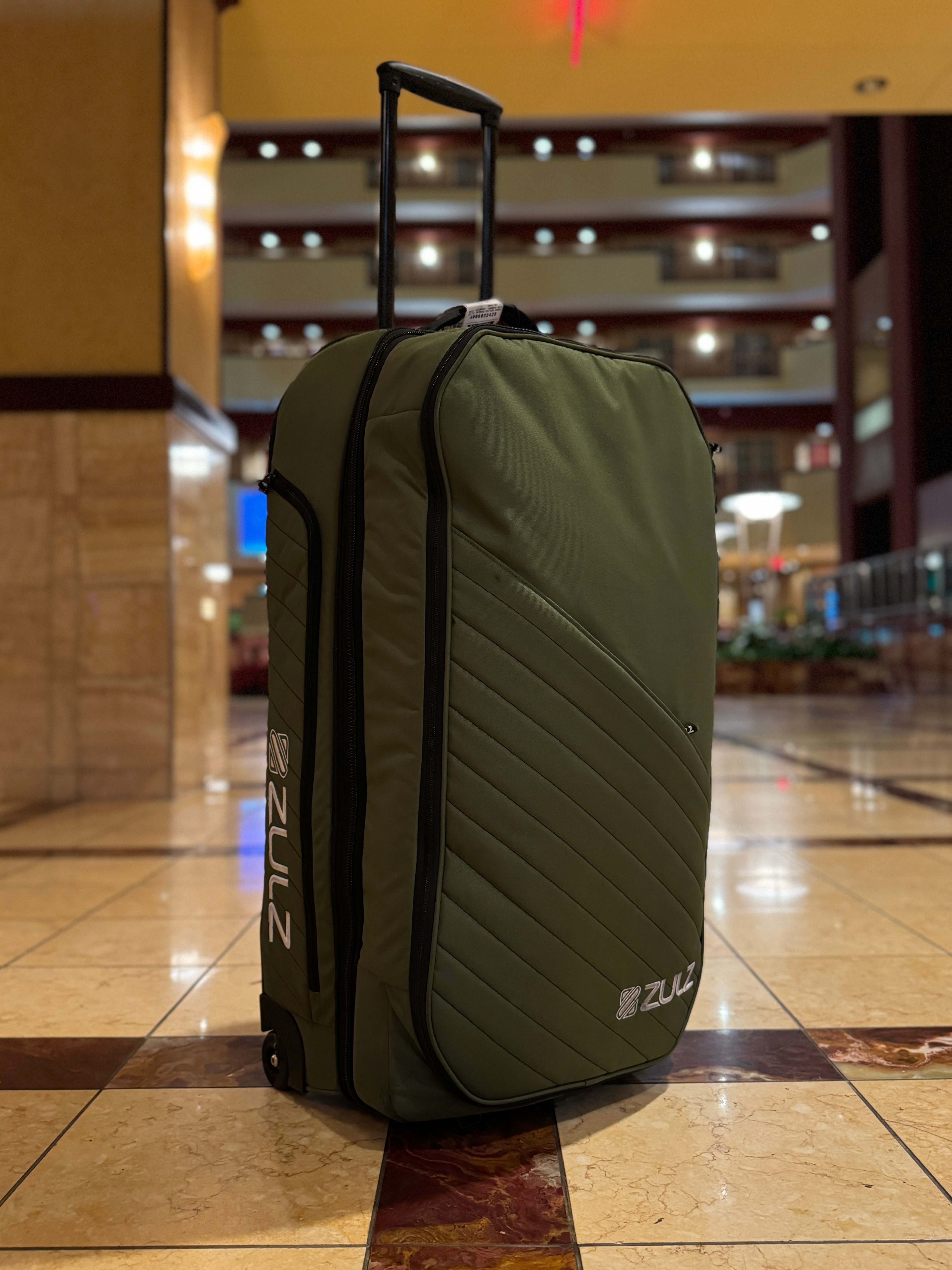 A checksize roller bag in lobby of luxury hotel